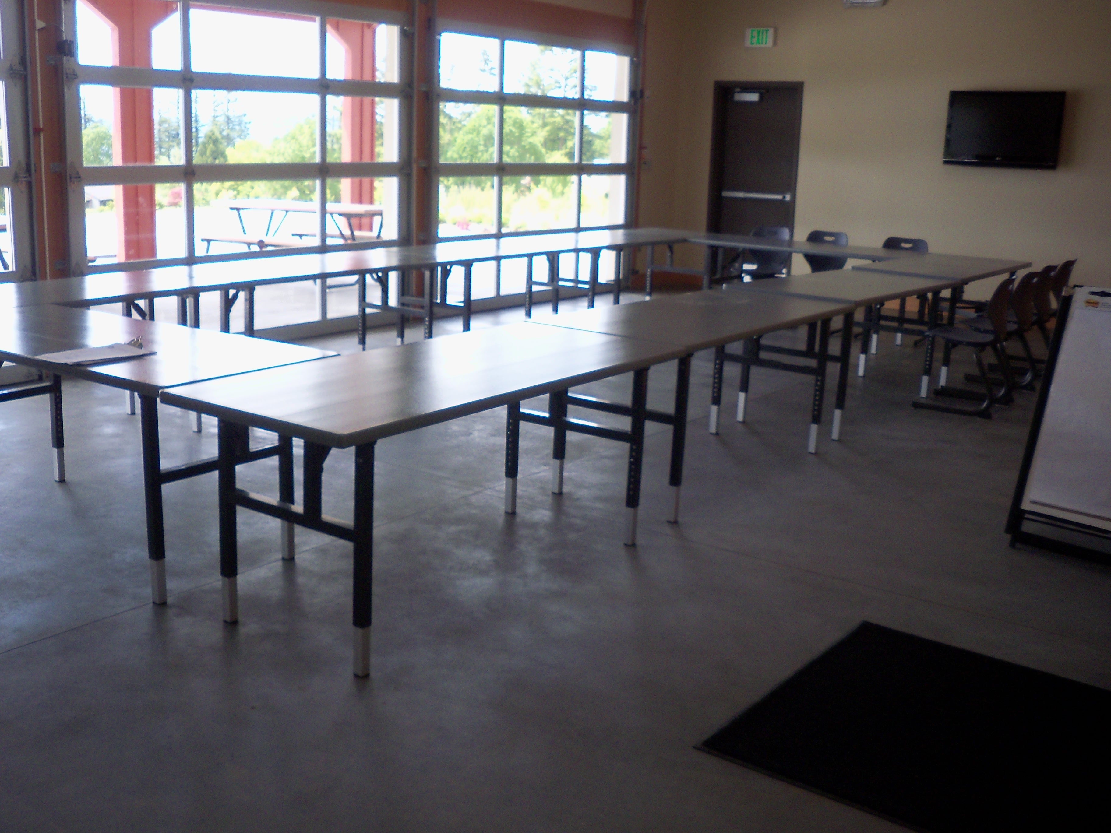 During nice weather, garage doors open on to patio.