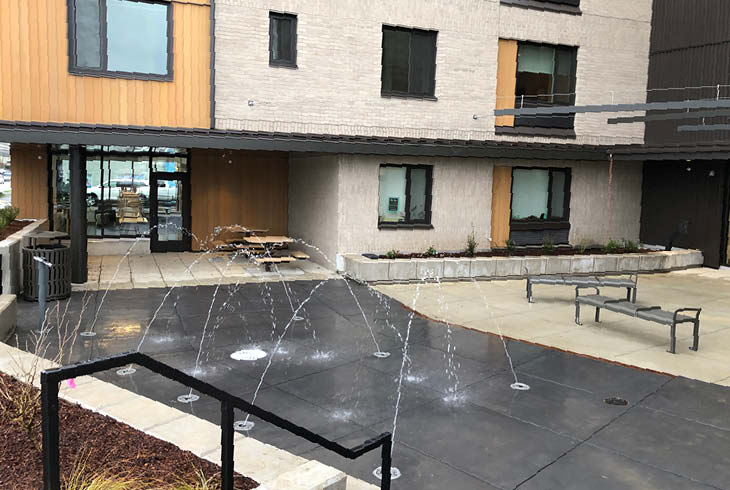 Reflections Plaza splashpad, picnic tables, and benches